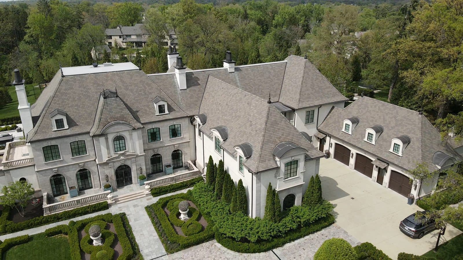 Aerial view of a new shingle roof on a St. Louis estate home installed by Revolve Construction
