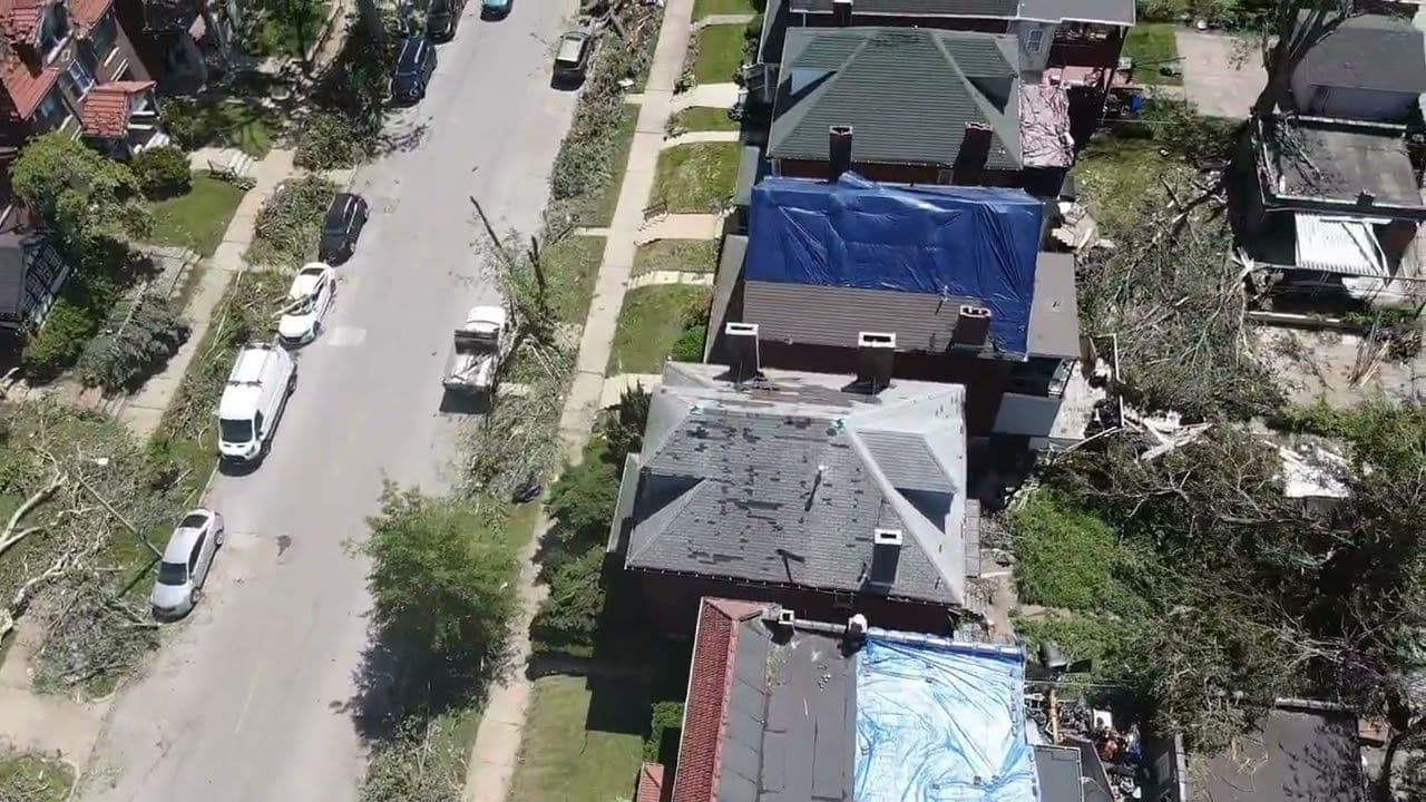 Aerial view of storm-damaged St. Louis roofs tarped by Revolve Construction