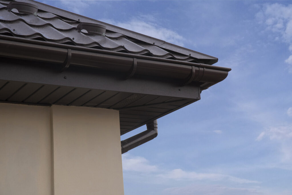 Rain gutter on house against sky